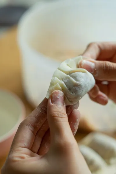 Contrast between artisanal dim sum making and industrial mass production