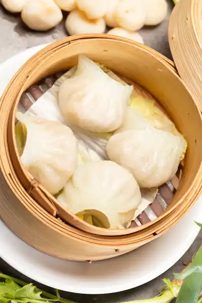 Har gao served in a traditional bamboo steamer