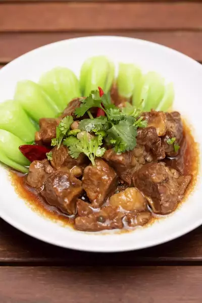 Beef braised in aromatic chu hou sauce close-up