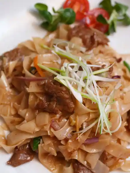 Rice noodles with beef (chow fun) fresh from the wok